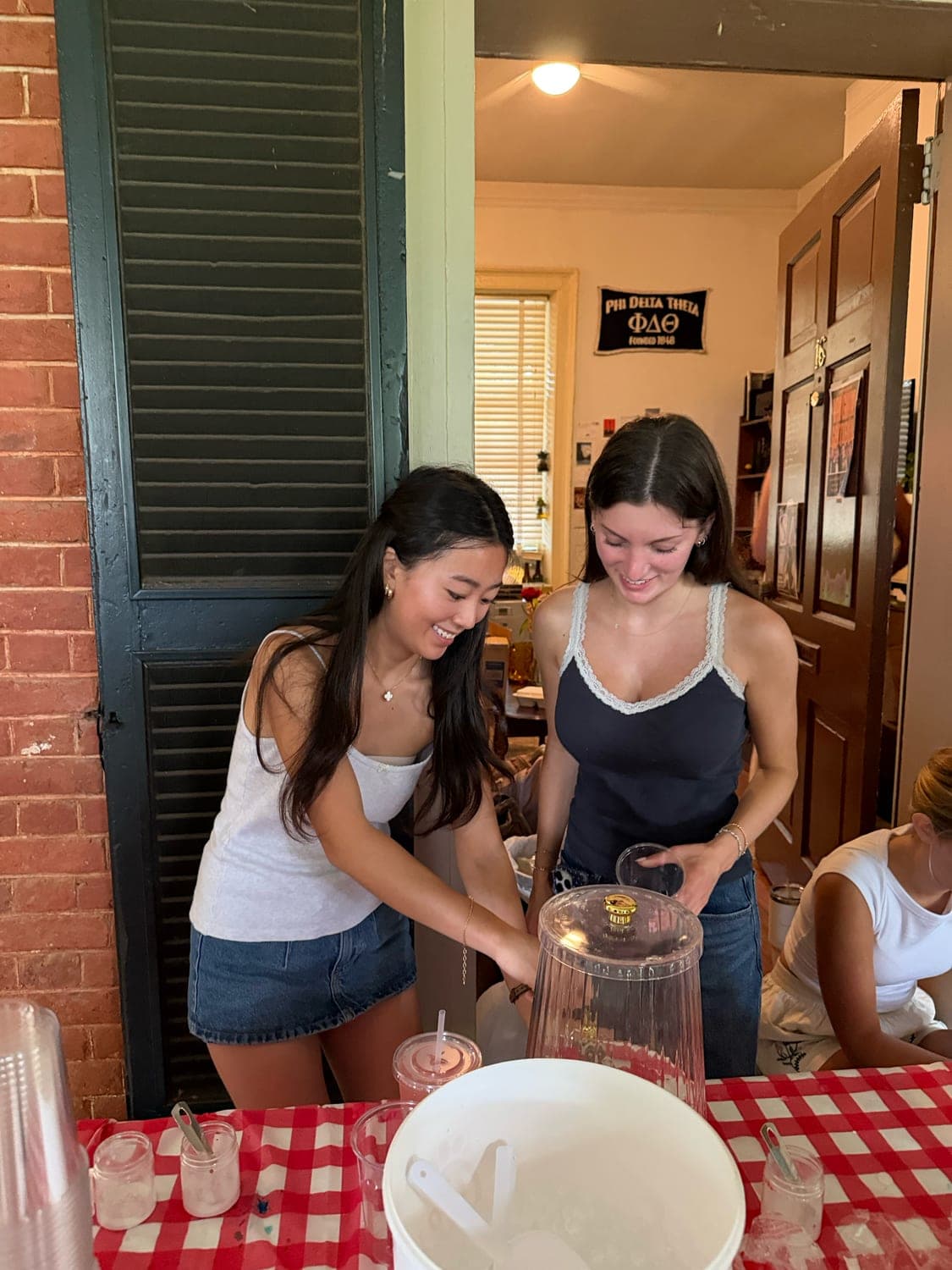 Our table on the Lawn, somebody mid pour